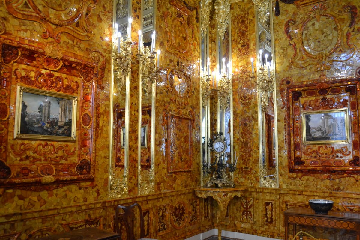 A clock and a large frame with medallions and cameos depicting biblical scenes, engraved landscapes, and Florentine mosaics. The painting "Vision"